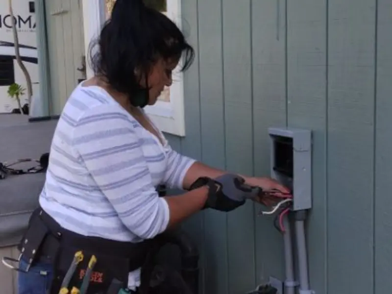 Licensed electrician wiring an exterior subpanel in Bullskin